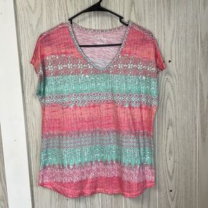 Coral Bay small short sleeve v-neck shirt. Pink and teal print